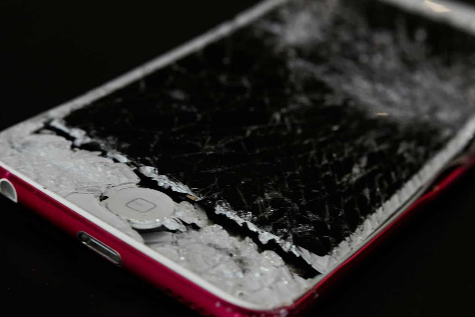 Smartphone with a badly shattered front glass panel