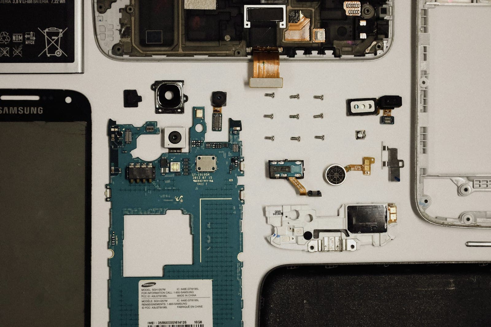 Smartphone components laid out after disassembly